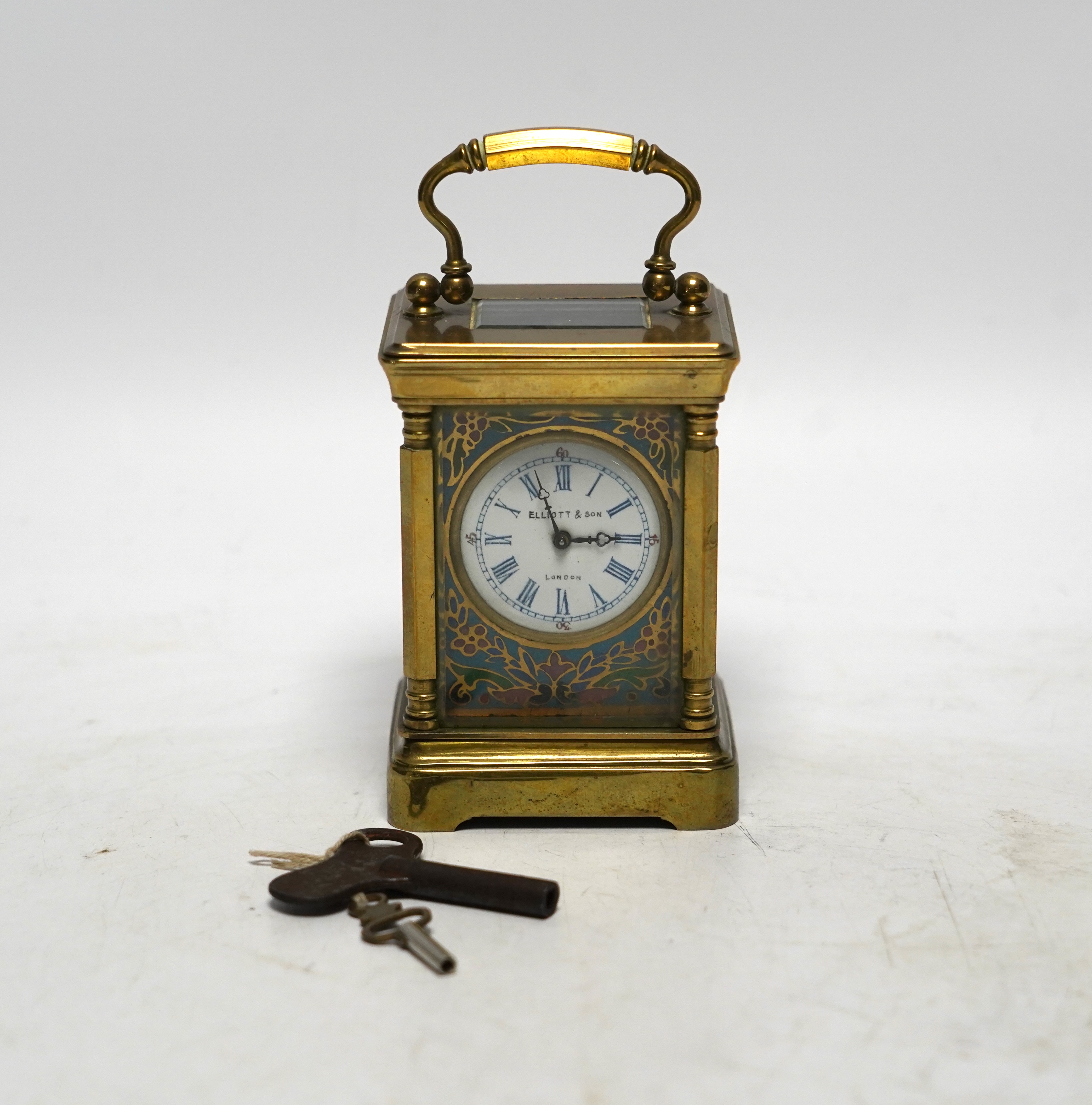 A miniature French brass carriage clock, with champlevé enamel panels, face signed Elliott & Son, London, 8.5cm